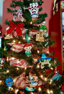 Our tree filled with travel ornaments